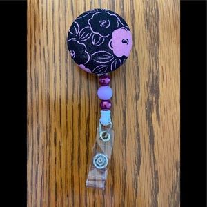 Handmade Black and Purple Flower Interchangeable Badge Topper and reel.